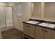 Bathroom with double sink vanity and a walk-in shower with glass door at 5810 Hwy 9, Nichols, SC 29581