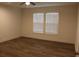 This bedroom has durable wood-look floors, a window, and neutral-painted walls at 5810 Hwy 9, Nichols, SC 29581