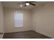 Bright bedroom features a modern ceiling fan, a window with blinds, and neutral wall paint at 5810 Hwy 9, Nichols, SC 29581