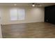 Bright living room with light-colored wood floors and large windows providing natural light at 5810 Hwy 9, Nichols, SC 29581