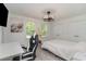 Bright bedroom with natural light, wood floors, white walls and trim, and a desk area at 5811 Sumter Dr., Myrtle Beach, SC 29577