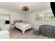 Inviting bedroom with neutral tones, a large window, and unique light fixture at 5811 Sumter Dr., Myrtle Beach, SC 29577