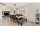 Open-concept dining area features a rustic table with seating and an adjacent window at 5811 Sumter Dr., Myrtle Beach, SC 29577