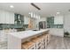 Modern kitchen with stainless steel appliances, white cabinetry, a large island, and stylish pendant lighting at 5811 Sumter Dr., Myrtle Beach, SC 29577