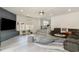 Bright and airy living room features a gray accent wall, comfortable seating, and large windows at 5811 Sumter Dr., Myrtle Beach, SC 29577