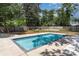 Backyard pool area with a surrounding concrete patio and an enclosed fence at 5811 Sumter Dr., Myrtle Beach, SC 29577