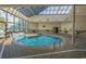 Bright and modern indoor swimming pool featuring a glass ceiling at 5905 S Kings Hwy. # 327 A, Myrtle Beach, SC 29575