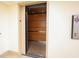 Interior view of the elevator, featuring wood-paneled walls at 5905 South Kings Hwy. # 706, Myrtle Beach, SC 29575