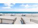 Beautiful beach scene with beach-goers enjoying the sunny day under sunshades and clear skies at 65 Lakeside Dr. # 65A, Pawleys Island, SC 29585