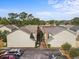 Aerial view of townhomes with manicured landscaping, surface parking, and brick walkways at 705 11Th Ave. S, North Myrtle Beach, SC 29582