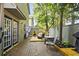 Private back patio area featuring a brick paved area, wood deck, and outdoor seating at 705 11Th Ave. S, North Myrtle Beach, SC 29582