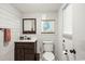 Bright bathroom featuring shiplap walls, vanity with a dark wood cabinet at 705 11Th Ave. S, North Myrtle Beach, SC 29582