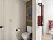 Bathroom with a toilet and storage rack at 705 11Th Ave. S, North Myrtle Beach, SC 29582