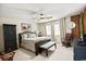 This spacious bedroom features modern furniture, a ceiling fan, and natural light at 705 11Th Ave. S, North Myrtle Beach, SC 29582