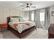 Comfortable bedroom with ceiling fan, two windows, and neutral decor at 705 11Th Ave. S, North Myrtle Beach, SC 29582