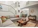 Spacious living room with a neutral color palette, leading into the dining area with a grand staircase at 705 11Th Ave. S, North Myrtle Beach, SC 29582