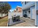 Backyard patio with modern table set and grill at 709 Shell Creek Circle # 709, North Myrtle Beach, SC 29582