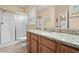 Bathroom featuring a granite countertop, wood cabinets, a shower, and a toilet at 709 Shell Creek Circle # 709, North Myrtle Beach, SC 29582