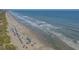 Aerial view of crowded beach and waves, featuring many people enjoying the sun at 709 Shell Creek Circle # 709, North Myrtle Beach, SC 29582