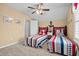 Bedroom with two twin beds, a ceiling fan, nautical decor, and neutral walls at 709 Shell Creek Circle # 709, North Myrtle Beach, SC 29582