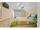 Bedroom featuring a quilt bedspread, a ceiling fan, and natural light from the window at 709 Shell Creek Circle # 709, North Myrtle Beach, SC 29582