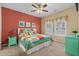 Bright bedroom featuring colorful ocean themed decor, a ceiling fan, and matching furniture at 709 Shell Creek Circle # 709, North Myrtle Beach, SC 29582