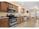 Functional kitchen with stainless steel appliances, granite counters, and tile flooring at 709 Shell Creek Circle # 709, North Myrtle Beach, SC 29582