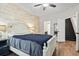 Bedroom showcasing wood-look floors, and a staircase visible through the doorway at 759 Painted Bunting Ct. # A, Murrells Inlet, SC 29576