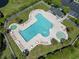 Aerial view of a resort-style community pool with lounge chairs and a hot tub at 759 Painted Bunting Ct. # A, Murrells Inlet, SC 29576