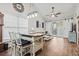 Bright and airy living room with a dining space featuring sliding barn doors to deck, perfect for relaxing and entertaining at 759 Painted Bunting Ct. # A, Murrells Inlet, SC 29576