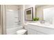 A pristine bathroom featuring a white vanity and a shower-tub combination at 836 Buttonwood Dr., Conway, SC 29527