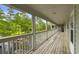 Wide angle of painted white balcony with view of parking lot and trees in the community at 922 Fairwood Lakes Ln. # 22M, Myrtle Beach, SC 29588