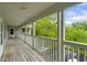 Spacious balcony overlooking the trees with painted white rails and door to the units at 922 Fairwood Lakes Ln. # 22M, Myrtle Beach, SC 29588