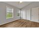 An empty bedroom with natural light from two windows at 922 Fairwood Lakes Ln. # 22M, Myrtle Beach, SC 29588