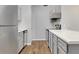 Galley kitchen features stainless steel appliances and bright countertops at 922 Fairwood Lakes Ln. # 22M, Myrtle Beach, SC 29588