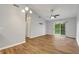 Bright living room with hardwood floors and sliding glass doors to a private balcony at 922 Fairwood Lakes Ln. # 22M, Myrtle Beach, SC 29588