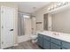 Well-lit bathroom features a shower-tub combo, and modern vanity with storage at 9545 Sullivan Dr., Murrells Inlet, SC 29576