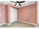 Neutral bedroom with closet, ceiling fan, and modern flooring, offering a comfortable space at 9545 Sullivan Dr., Murrells Inlet, SC 29576