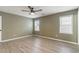 Inviting bedroom with natural light, ceiling fan, and fresh, neutral walls at 9545 Sullivan Dr., Murrells Inlet, SC 29576