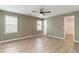 Spacious bedroom boasts ceiling fan, neutral walls, and a walk-in closet at 9545 Sullivan Dr., Murrells Inlet, SC 29576