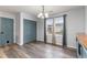 A lovely dining area with wood floors and a large window at 9545 Sullivan Dr., Murrells Inlet, SC 29576