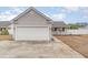 Single-Gathering home with a spacious two-car garage and a quaint, covered front porch at 9545 Sullivan Dr., Murrells Inlet, SC 29576