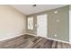 Neutral living room with sleek floors, a front door, and plenty of natural light at 9545 Sullivan Dr., Murrells Inlet, SC 29576