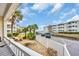 Balcony overlooking tropical landscaping, parking area, and adjacent buildings at 9620 Shore Dr. # C101, Myrtle Beach, SC 29572