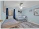 Cozy blue bedroom with twin beds, ceiling fan and matching bedspreads at 9620 Shore Dr. # C101, Myrtle Beach, SC 29572