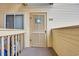 Welcoming condo entrance featuring a 'Welcome' sign and a cozy, private balcony at 9620 Shore Dr. # C101, Myrtle Beach, SC 29572