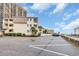 Exterior view of condo buildings with parking in foreground at 9620 Shore Dr. # C101, Myrtle Beach, SC 29572
