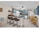 Kitchen view with seating at the bar overlooking matching appliances and decor at 9620 Shore Dr. # C101, Myrtle Beach, SC 29572