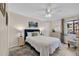 Comfortable bedroom with neutral décor, ceiling fan and an abundance of natural light at 9620 Shore Dr. # C101, Myrtle Beach, SC 29572