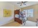 Bedroom with carpet, a window, a ceiling fan, and a wooden bunk bed at 10 Orchard Ave., Murrells Inlet, SC 29576